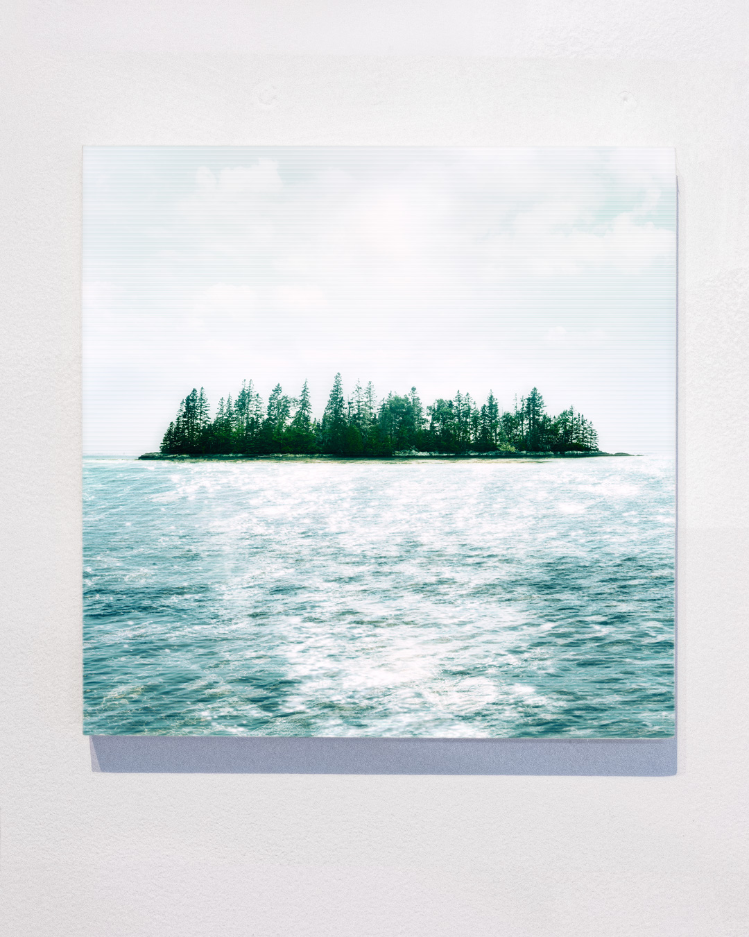 Maine island with sunset, water reflections and graphics inspired by the Anthropocene